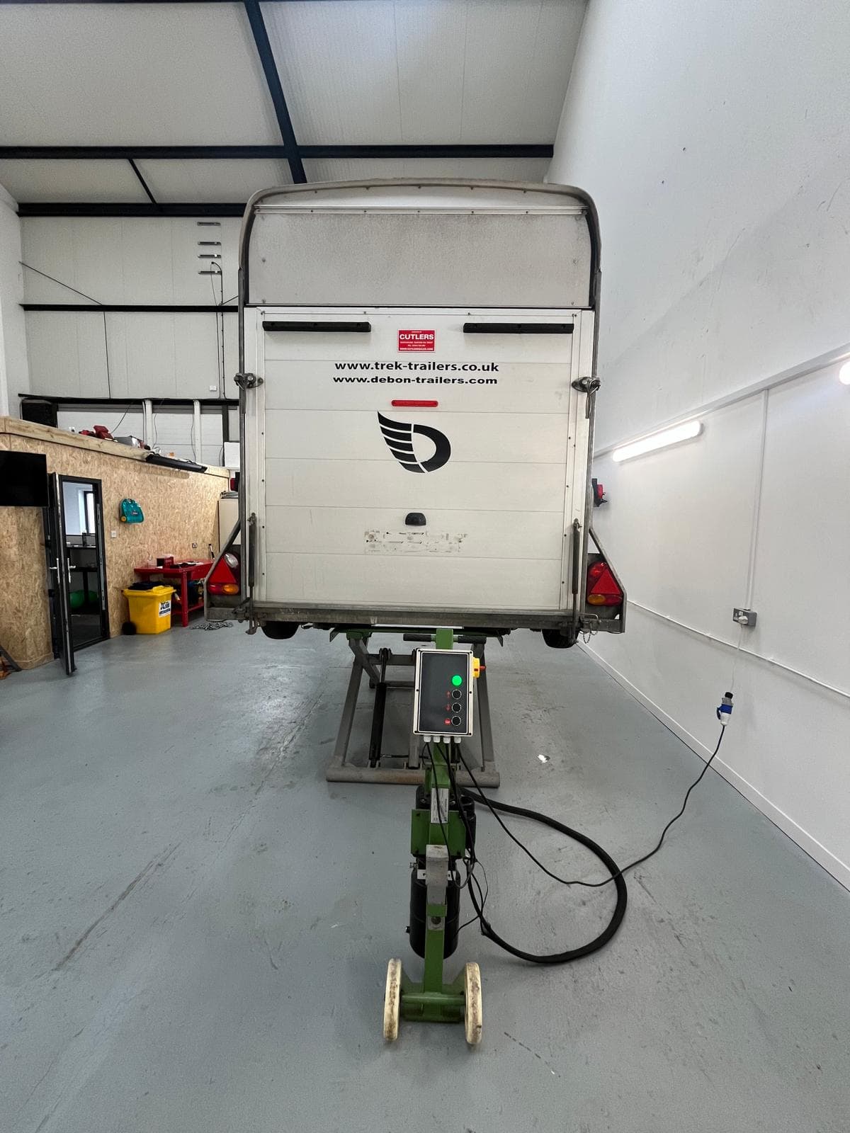 Rear of a Debon box trailer on the trailer lift