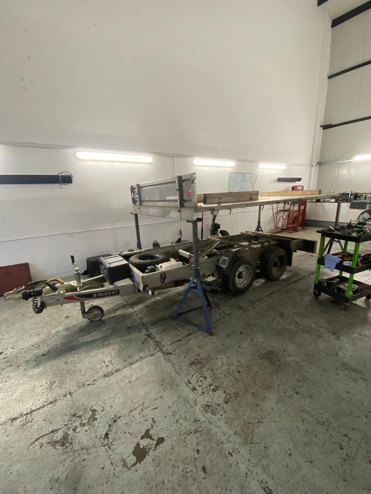 Nugent trailer stripped down on stands in the workshop